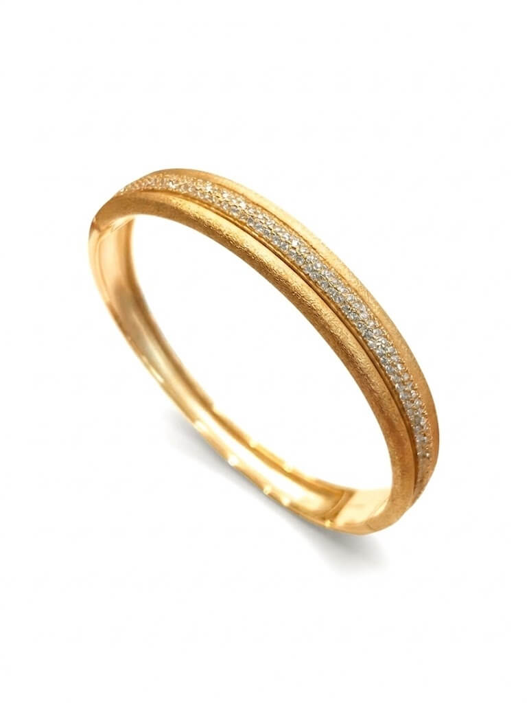 Bracciale rigido placcato in oro satinato con zirconi