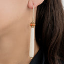 Orecchini in argento 925 placcato oro giallo ad amo con osso e corallo rosso