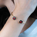 Bracciale rigido con onice e corallo rosso